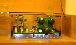 Photo of TRANSPARENT 3D Six preamplifier, used inside a wooden cabinet