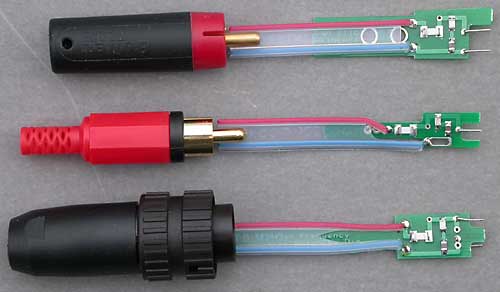 DNM High Frequency Termination Networks for DNM interconnect cable, with their matching plugs on the left